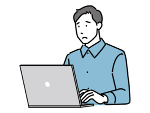 パソコンの前で悩むフリーランスの男性のイラスト